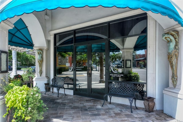 entrance to property featuring french doors