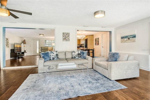 living area with wood-type flooring and visible vents