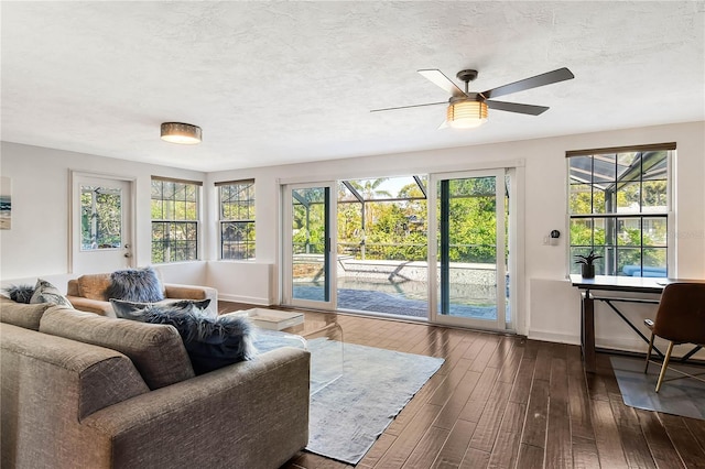 sunroom featuring a ceiling fan and a healthy amount of sunlight