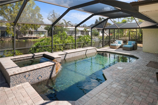 view of swimming pool with a patio area, a lanai, and a pool with connected hot tub