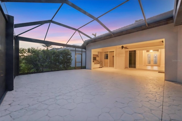 exterior space with a lanai, ceiling fan, and a patio area