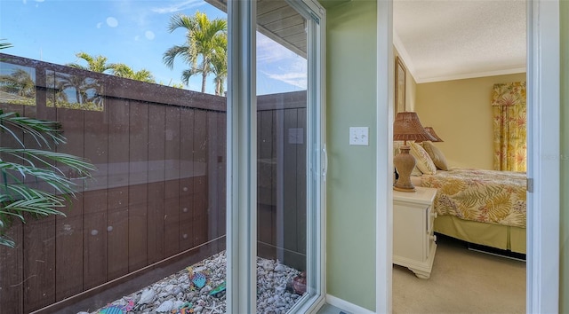 exterior space featuring crown molding and a textured ceiling