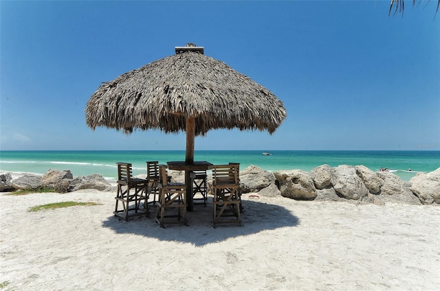 property view of water featuring a beach view