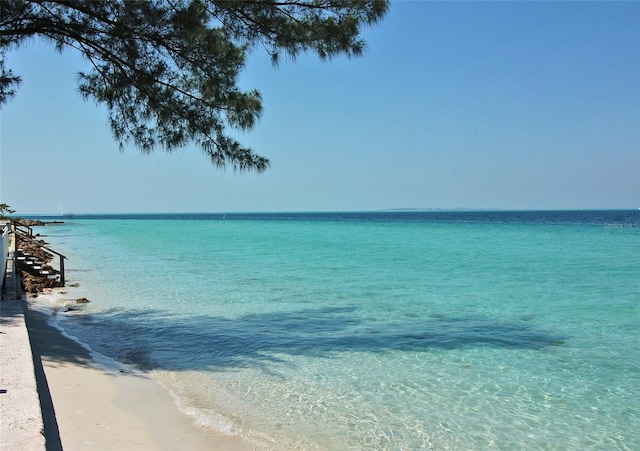 property view of water featuring a beach view