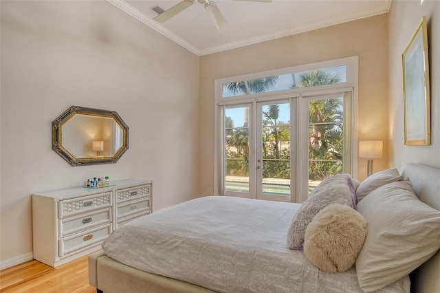 bedroom with ornamental molding, ceiling fan, access to exterior, and light hardwood / wood-style floors