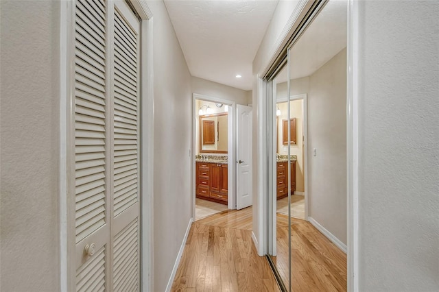 corridor featuring light hardwood / wood-style floors