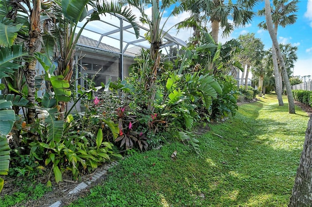 view of yard featuring glass enclosure