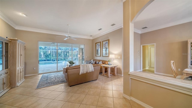 tiled living room featuring ornamental molding and ceiling fan