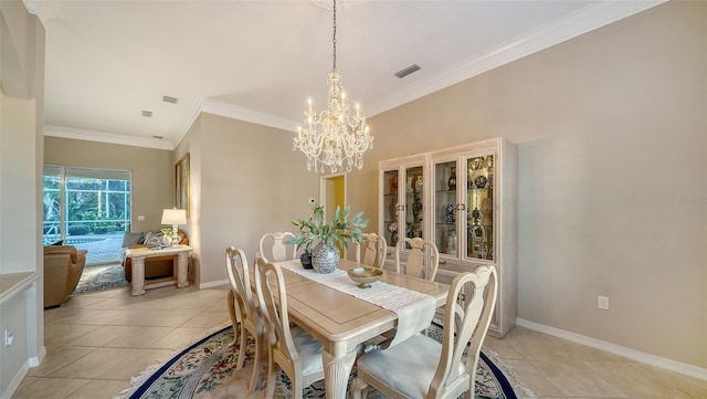 dining room with crown molding, a chandelier, and light tile patterned floors