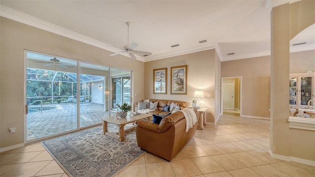 living room with crown molding, light tile patterned floors, and ceiling fan