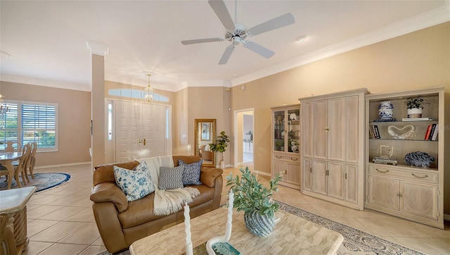 living room featuring light tile patterned floors, ornamental molding, and ceiling fan