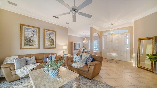 tiled living room featuring crown molding and ceiling fan with notable chandelier