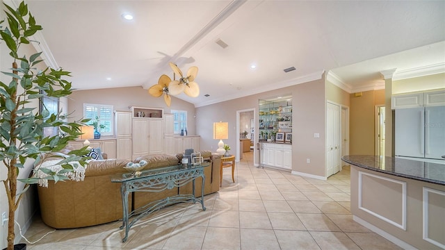 living room with crown molding, lofted ceiling, and light tile patterned floors