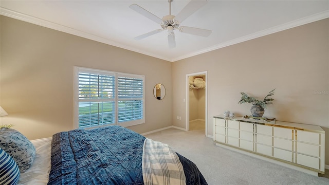 bedroom with light carpet, a walk in closet, ornamental molding, and ceiling fan