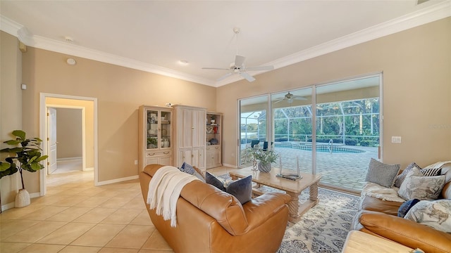 living room featuring light tile patterned floors, ornamental molding, and ceiling fan