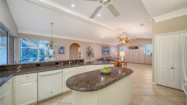 kitchen with white dishwasher, sink, hanging light fixtures, and white cabinets