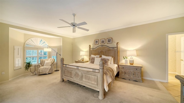 bedroom with ceiling fan, light colored carpet, and ornamental molding