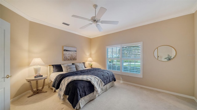 carpeted bedroom with ornamental molding and ceiling fan