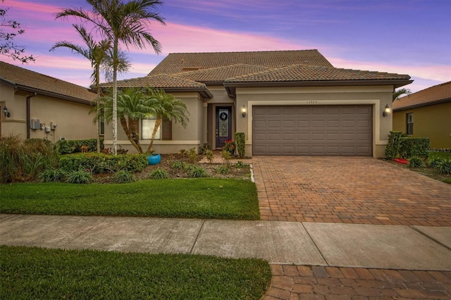 mediterranean / spanish-style house featuring a garage