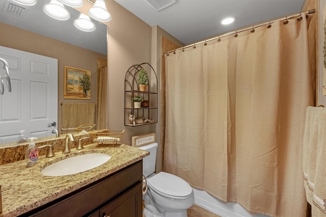 full bathroom featuring vanity, shower / bath combo, and toilet