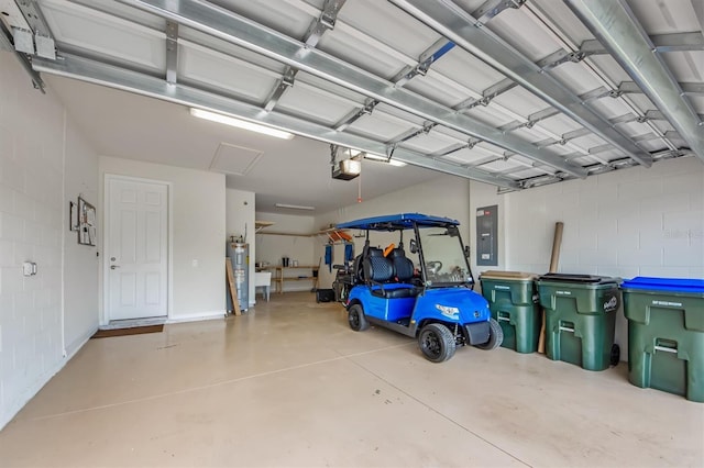 garage featuring a garage door opener, electric panel, and water heater