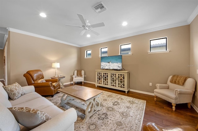 living room featuring crown molding, dark wood-type flooring, and ceiling fan