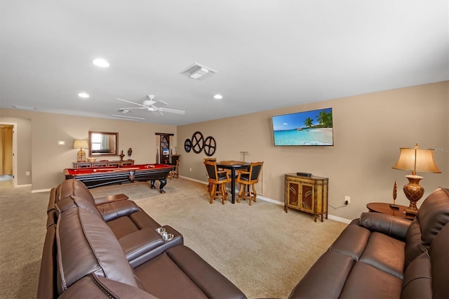 living room with light carpet, pool table, and ceiling fan