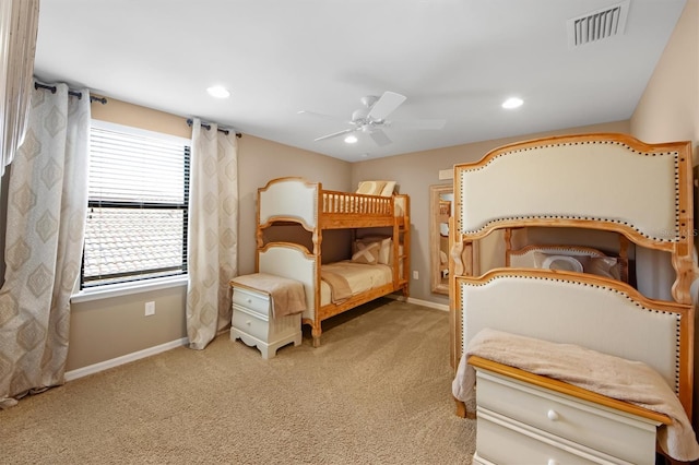 bedroom with ceiling fan and light colored carpet