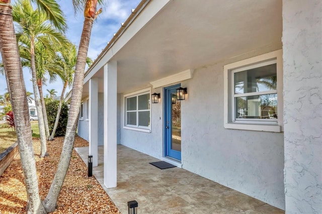 property entrance with a patio