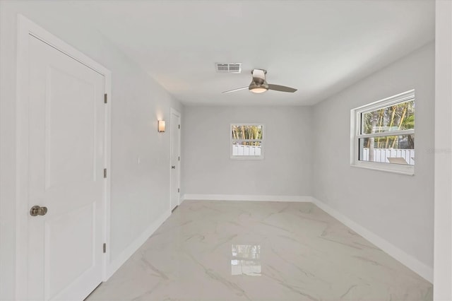 spare room featuring ceiling fan