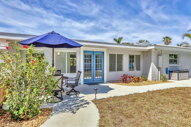 back of house featuring a patio and french doors