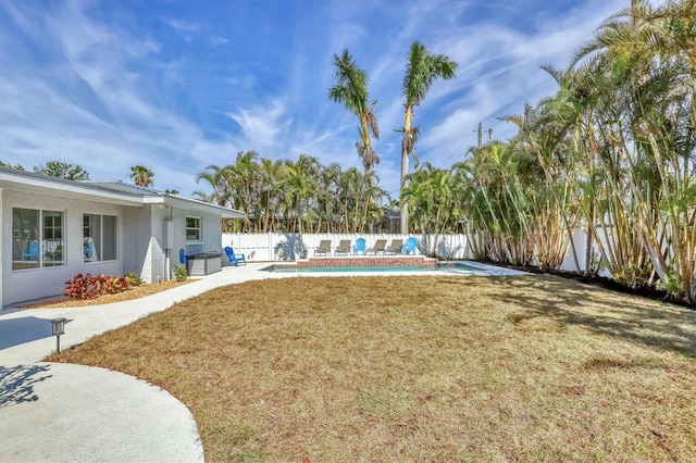 view of yard with a fenced in pool