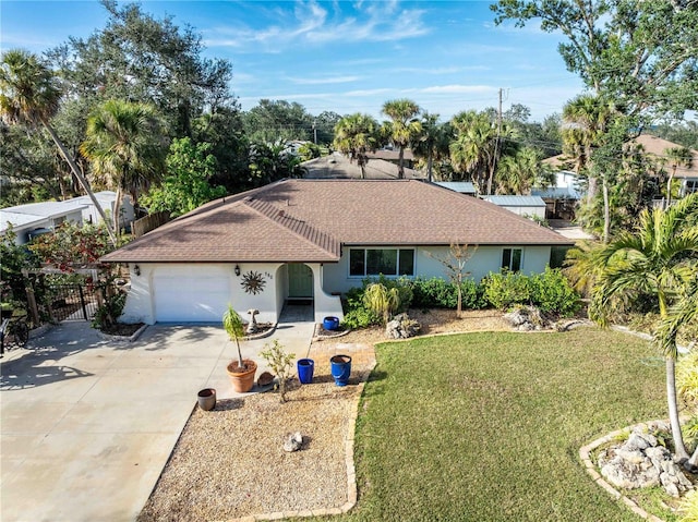 ranch-style home featuring a garage and a front lawn