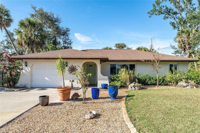 single story home with a garage and a front yard