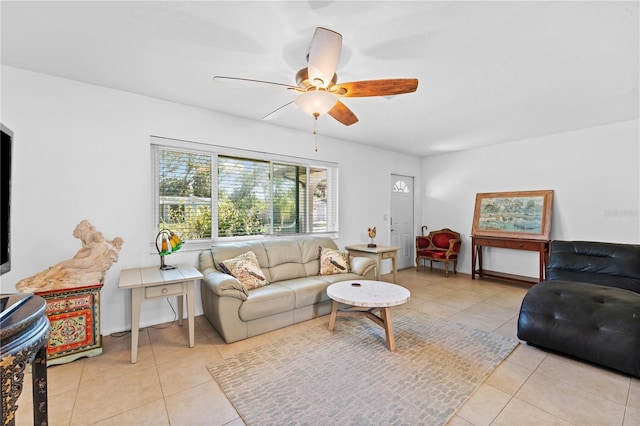 living room featuring light tile patterned flooring and ceiling fan