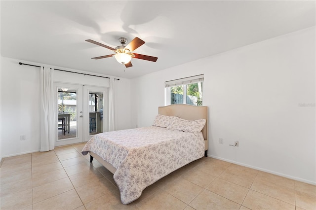 bedroom with access to exterior, light tile patterned floors, french doors, and ceiling fan