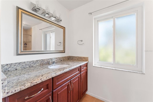 bathroom featuring vanity and a shower