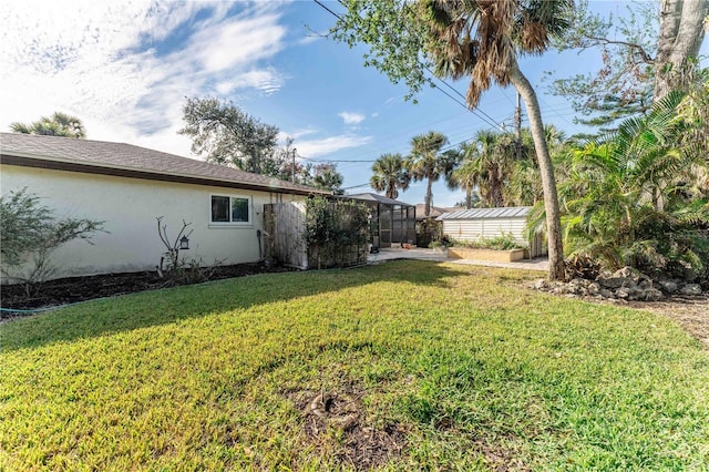 view of yard with a lanai