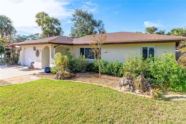 single story home featuring a garage and a front yard