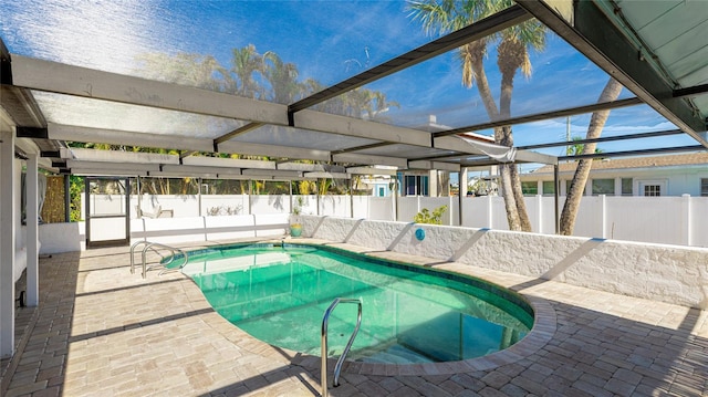 view of pool with a lanai and a patio area