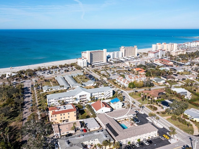 bird's eye view featuring a water view and a view of the beach