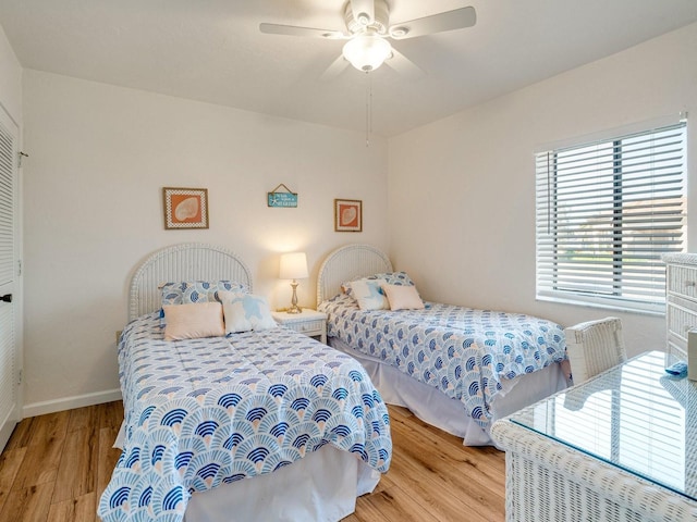 bedroom featuring light hardwood / wood-style floors and ceiling fan