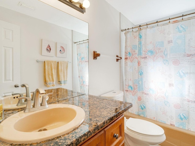 full bathroom featuring vanity, toilet, and shower / bath combo