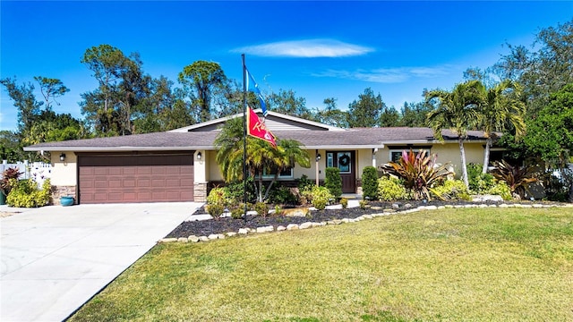 ranch-style home featuring a garage and a front yard