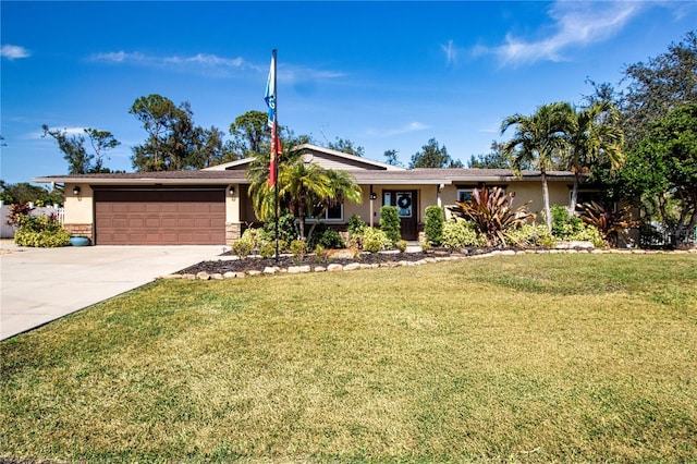 single story home with a garage and a front lawn