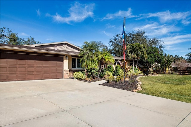 ranch-style house with a garage and a front yard