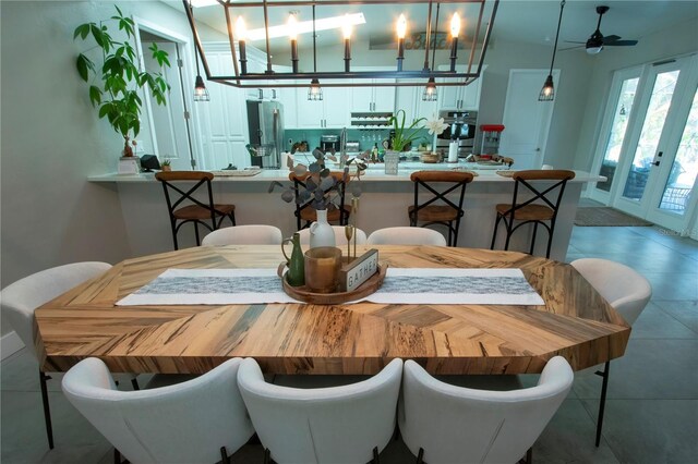 dining room with ceiling fan and french doors