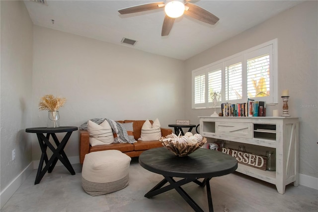 sitting room featuring ceiling fan