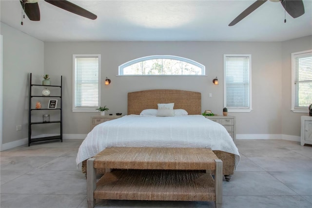 bedroom with multiple windows and ceiling fan