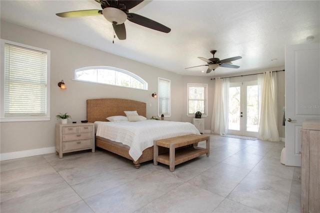 bedroom with ceiling fan, multiple windows, and access to outside